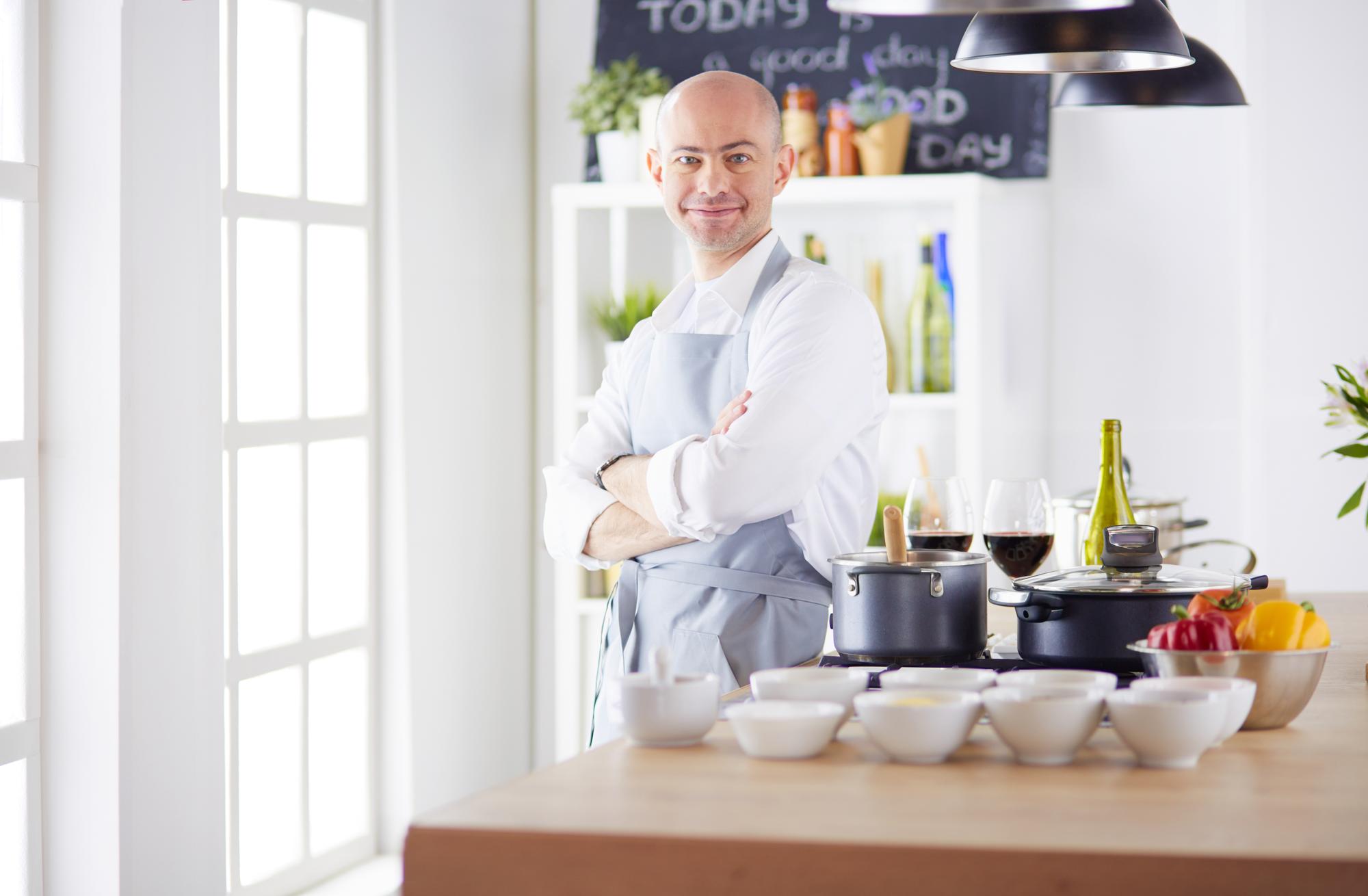 Studio kitchen with chef and natural light